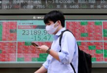 As oil falls Asia shares pare gains on caution